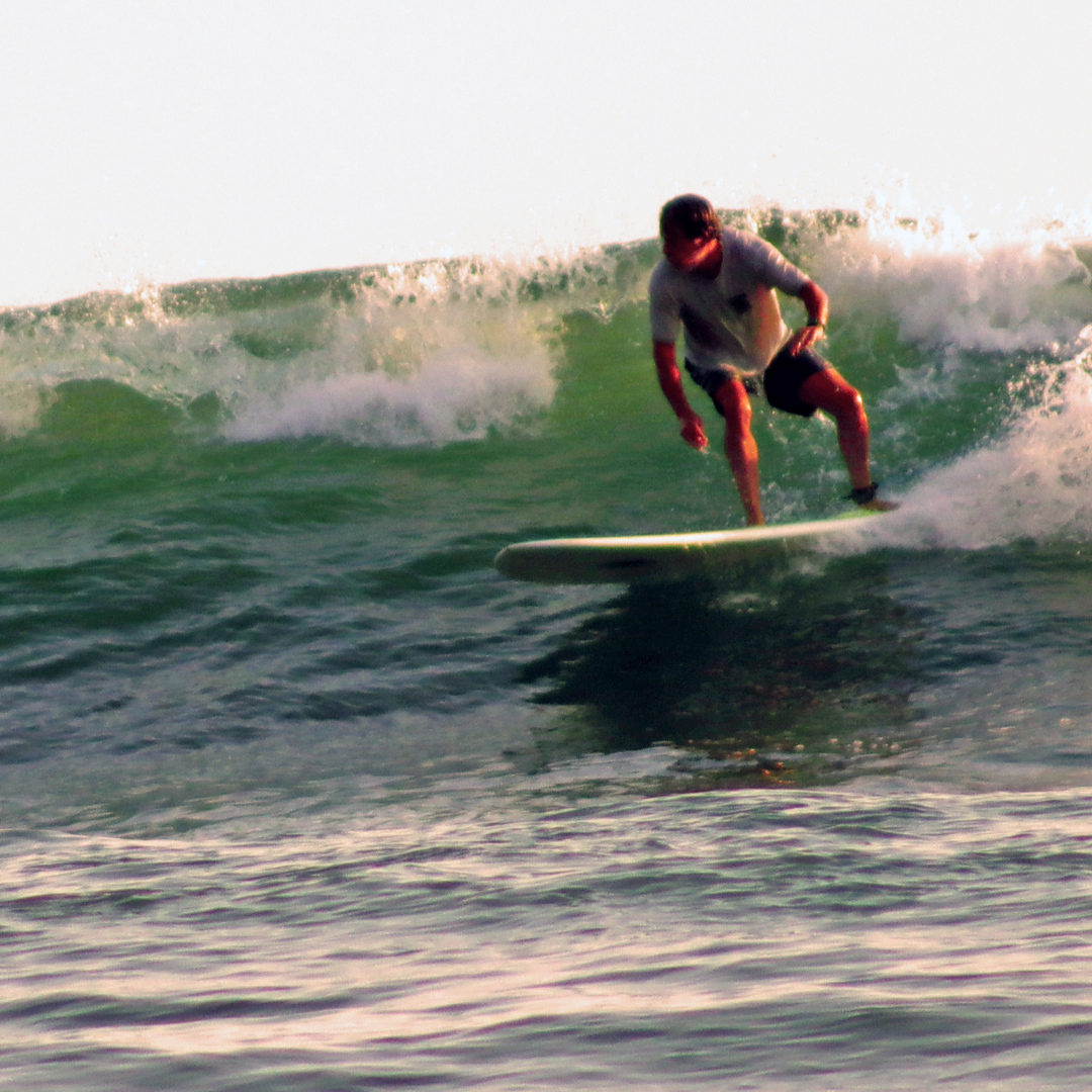 surfer on longboard